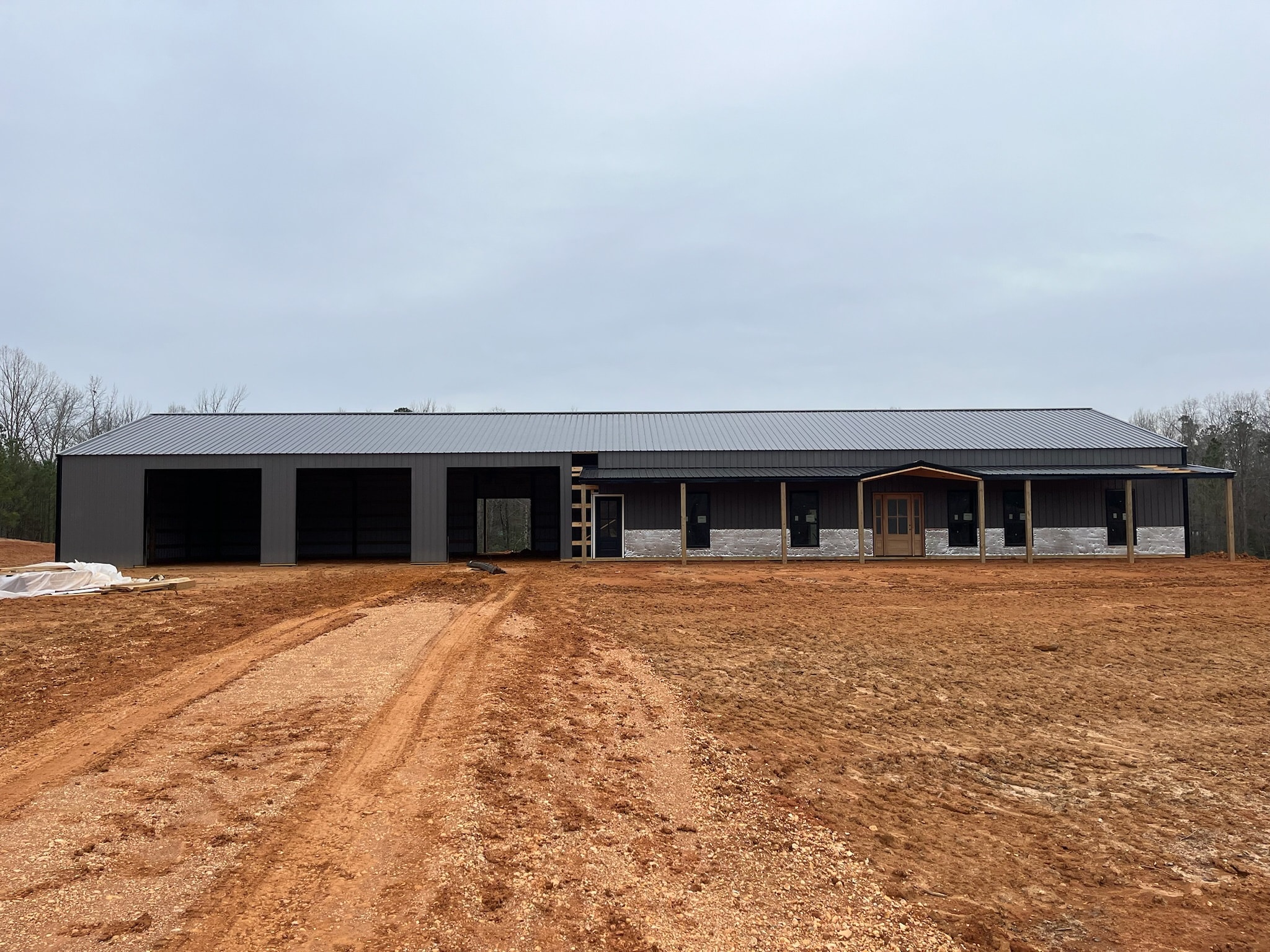 Quality Barns & More pole barn with covered porch