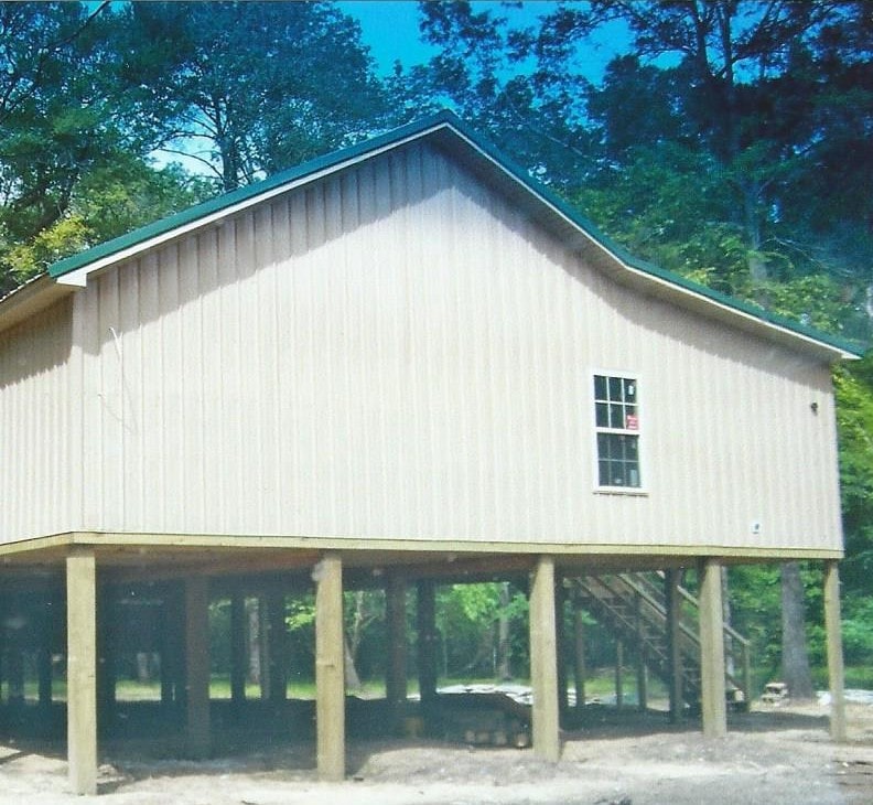 Quality Barns & More river house completed build