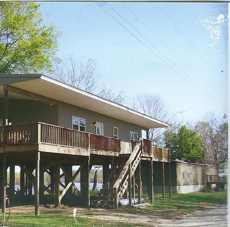 Quality Barns & More river house on stilts